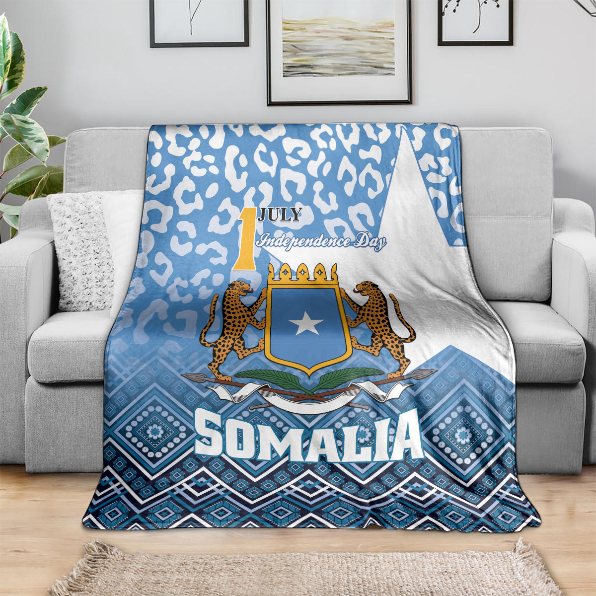 Blue and white Somalia blanket draped over sofa with shield star and leopard figures
