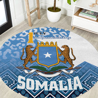 Round blue carpet with Somalia Independence Day shield star and leopard figures
