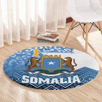 Round blue carpet with Somalia Independence Day shield star and leopard accents