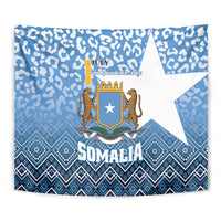 Close-up blue Somalia independence tapestry showing crest, star, leopard pattern, and SOMALIA