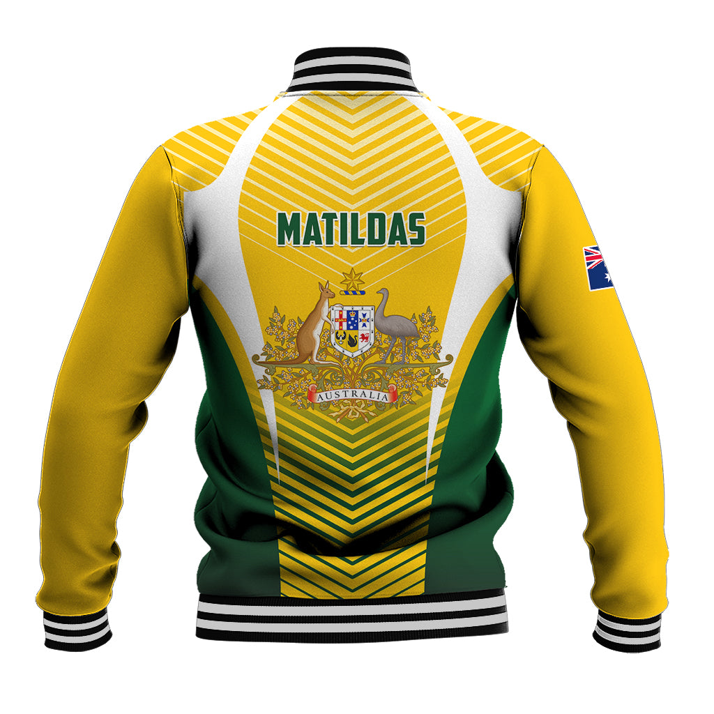 Back view of yellow varsity baseball jacket with MATILDAS print, green stripe panels, zip.