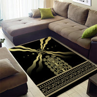 Black and gold corner patterned area rug with central emblem and ornate border.