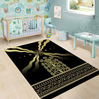 Black and gold ornate area rug with compass emblem, stars, and decorative stripe edge.