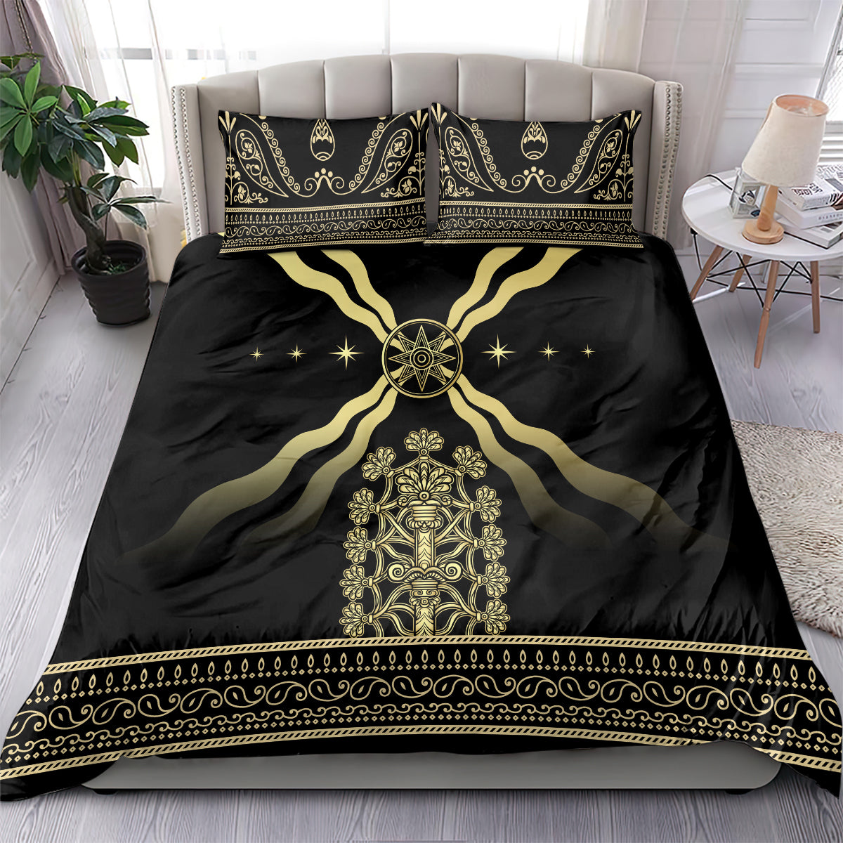 Black duvet and matching pillowcases with gold emblem, flowing curves, and decorative trim