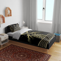 Black duvet with gold emblem stripes and star accents, plus matching patterned pillowcases