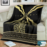 Black and gold mythological spirit blanket with central emblem and decorative band trim