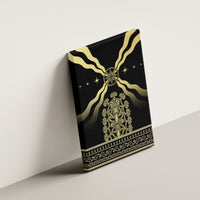 Black canvas wall art angled on wall with gold compass, radiating rays, and ornate centerpiece
