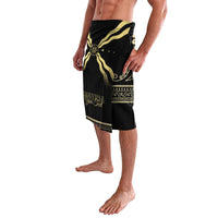 Black lava lava shorts with gold sunburst print and decorative trim