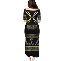 Black long dress, back print with gold emblem, decorative bands and short sleeves