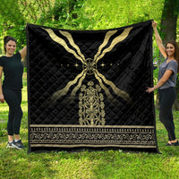 Black quilt blanket featuring a gold cross design, central emblem, and decorative trim