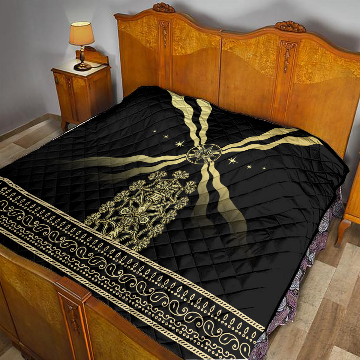 Black quilt blanket with gold cross motif, central medallion, and decorative border strip