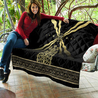 Black quilt blanket with gold cross design, glowing star accents, and detailed bottom trim