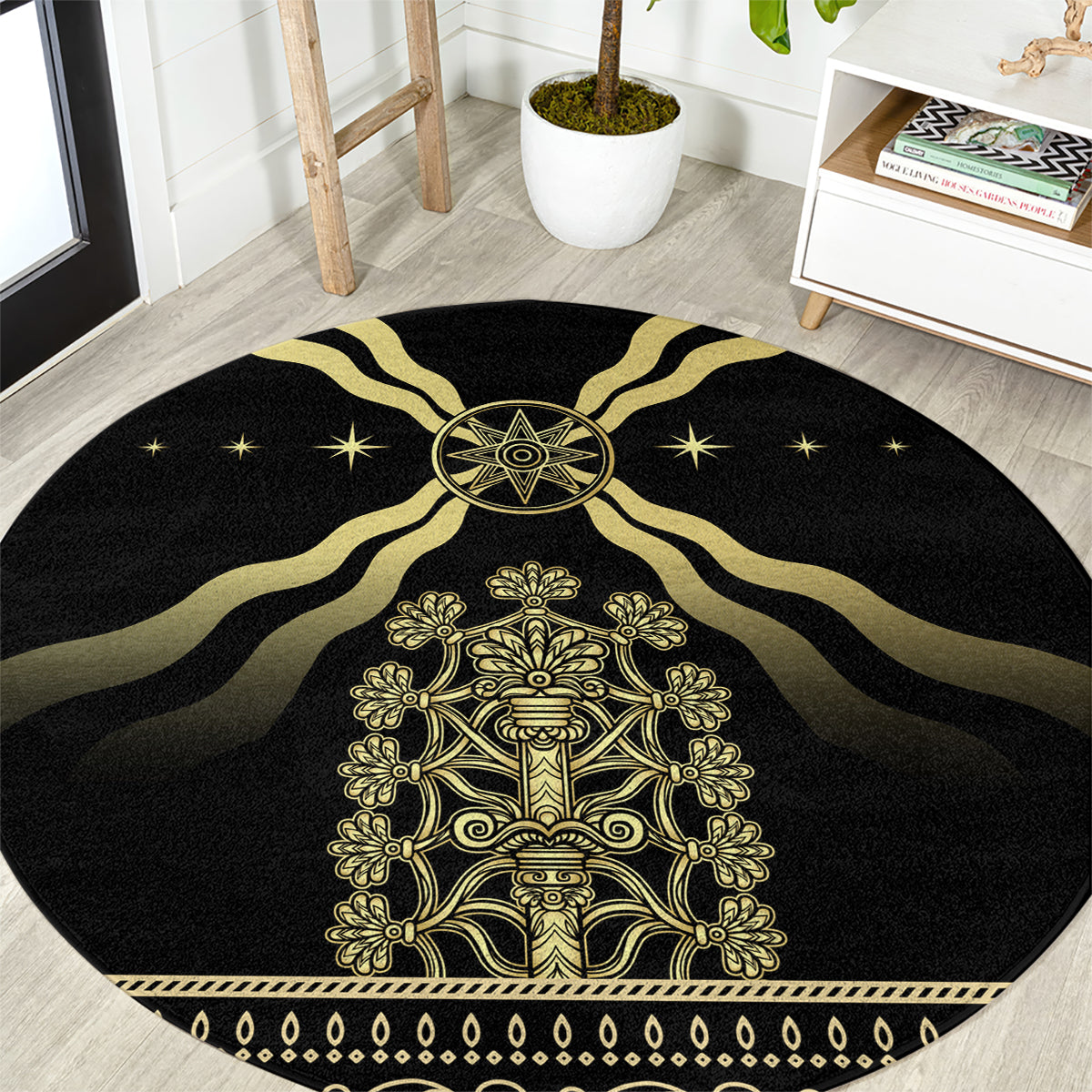 Black round area rug with gold emblem, star accents, and ornate border