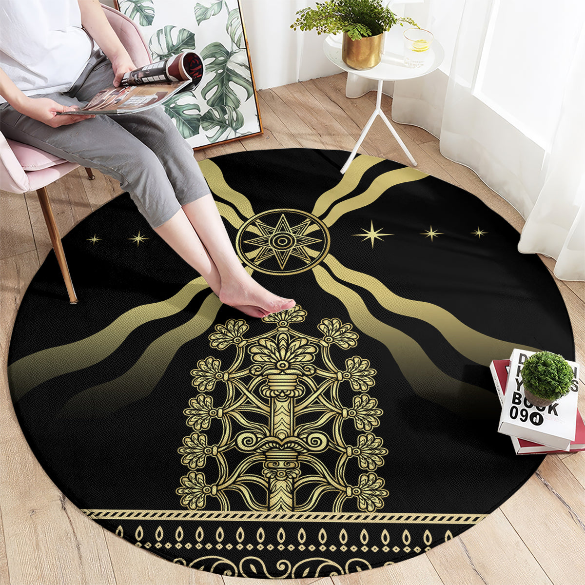 Black round carpet with gold central design, swirling rays, and star pattern edge