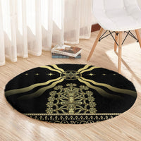 Black round carpet with gold central motif and swirl rays, star speckled edge