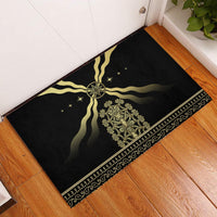 Black rubber doormat with gold sun emblem and decorative banding along edges