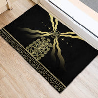 Black rubber doormat with gold crest and sunburst rays, edge trim with dots