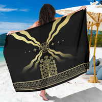 Black sarong with gold wave design, central star medallion, and ornate border