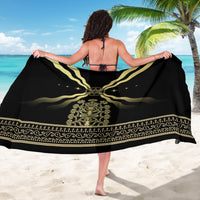 Black sarong with gold wave motif and central medallion, draped back view