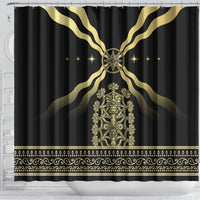 Black shower curtain with gold winged emblem, central ornate panel, and gold border trim