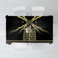 Black tablecloth with gold central crest, radiating lines, and ornate border hem
