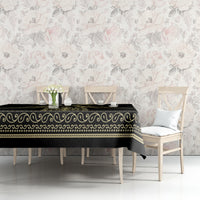 Black tablecloth with gold scroll trim and decorative edge border