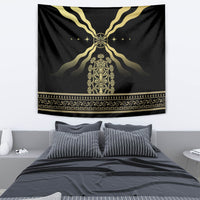 Black tapestry featuring gold emblem center, radiating V-shaped lines, and ornate border strip