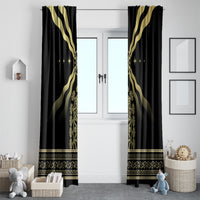 Black curtain panels with gold emblem vertical center and patterned gold hem band