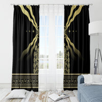 Black curtain set with gold sunburst pattern and decorative gold border at the bottom