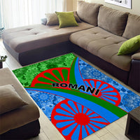 Green and blue patterned area rug with red sunburst circles and ROMANI text