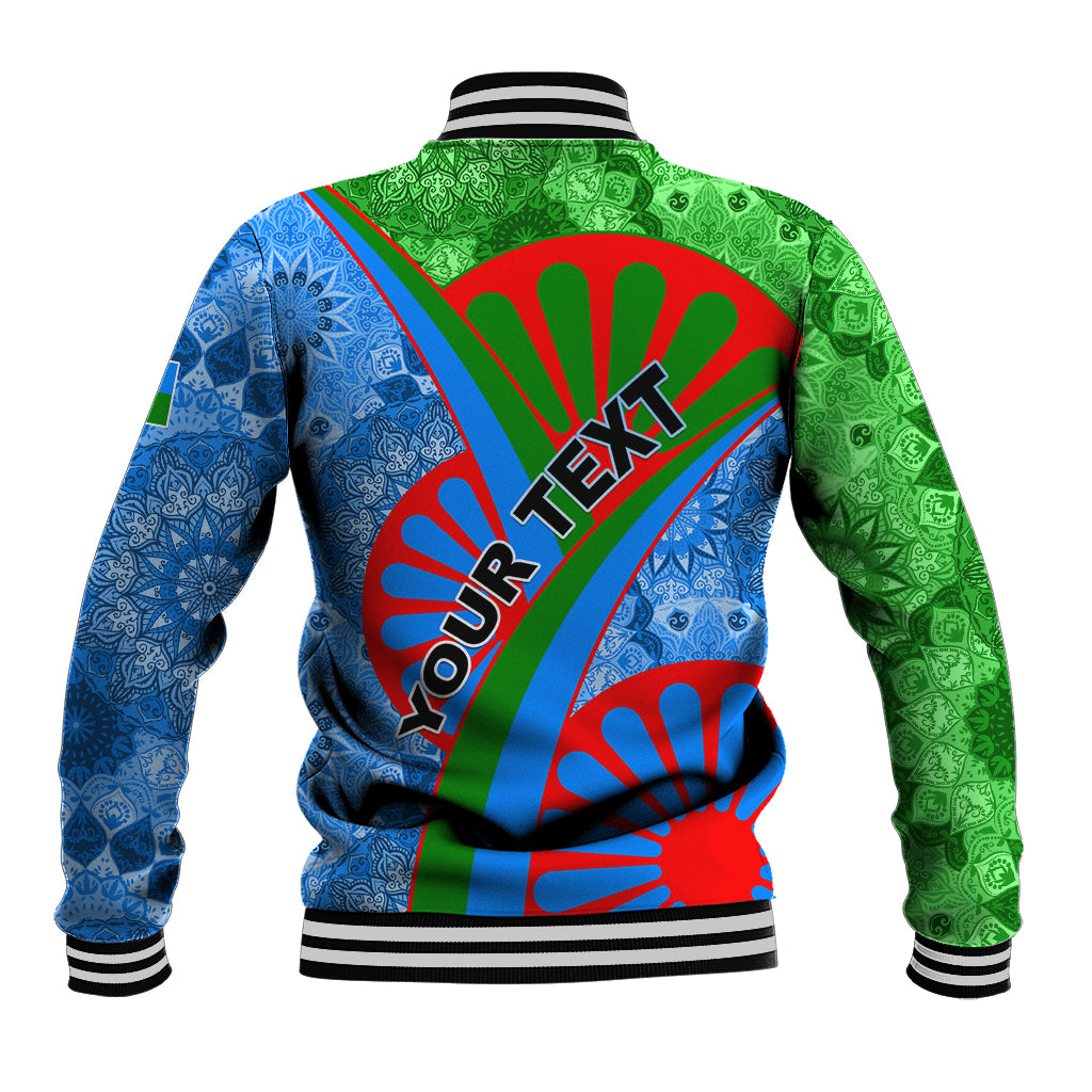 Unisex baseball jacket, back view with blue and green tribal print, red diagonal stripe, rib cuffs
