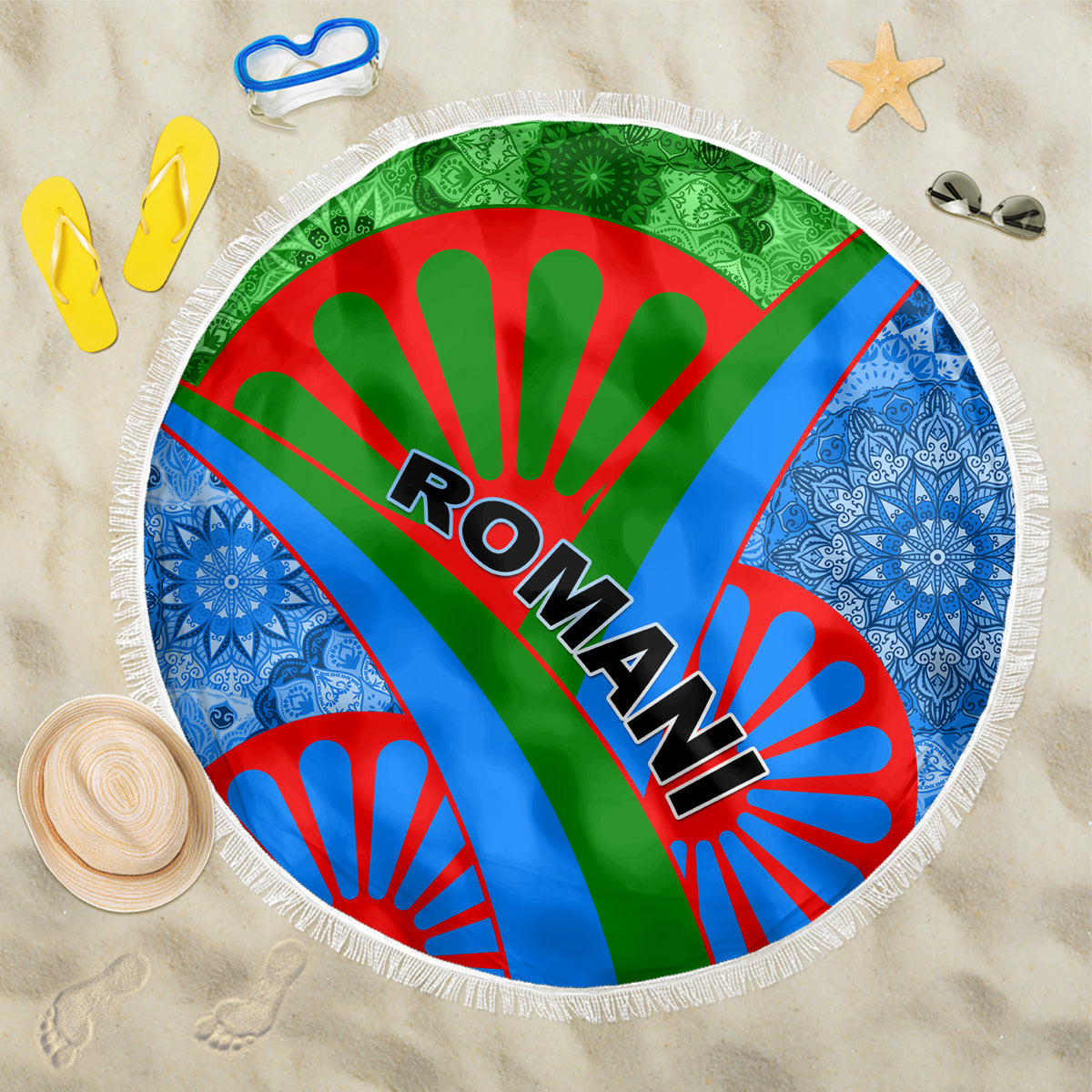 Round beach blanket with fringe, Romani text on green-red-blue rays and white border