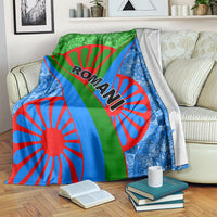 Green, blue, and red Roma pattern blanket folded over a sofa back