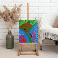 Canvas wall art on wooden easel with green blue red design and 'ROMANI' lettering
