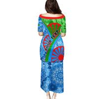 Back of women's long dress with vibrant tribal graphics, short sleeves, loose silhouette