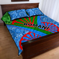 Romani quilt bed set with ROMANI text across blue mandala pattern, green-red stripes, two pillows