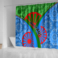 Romani-themed shower curtain with green and blue pattern, red sunburst symbols, central banner