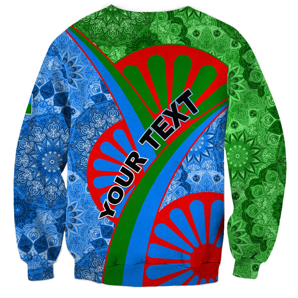 Unisex crewneck sweatshirt with green and blue tribal print, red accents, and bold lettering
