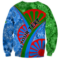 Unisex crewneck sweatshirt with green and blue tribal print, red accents, and bold lettering