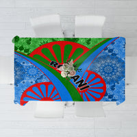 Multicolor patterned tablecloth with blue floral designs and green red accents