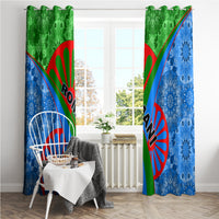 Blue and green window curtain pair with red sunburst emblems and tribal diagonal stripe design.