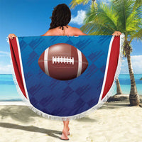 Round rugby beach blanket held up, blue-and-red Turks and Caicos Islands print with fringe