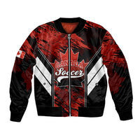 Black bomber jacket with Canada Soccer graphic, red accents, full zip, ribbed cuffs.