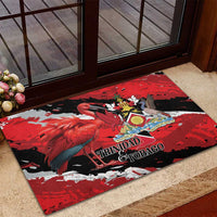 Red rubber doormat featuring flamingo illustration and coat-of-arms crest, rectangular