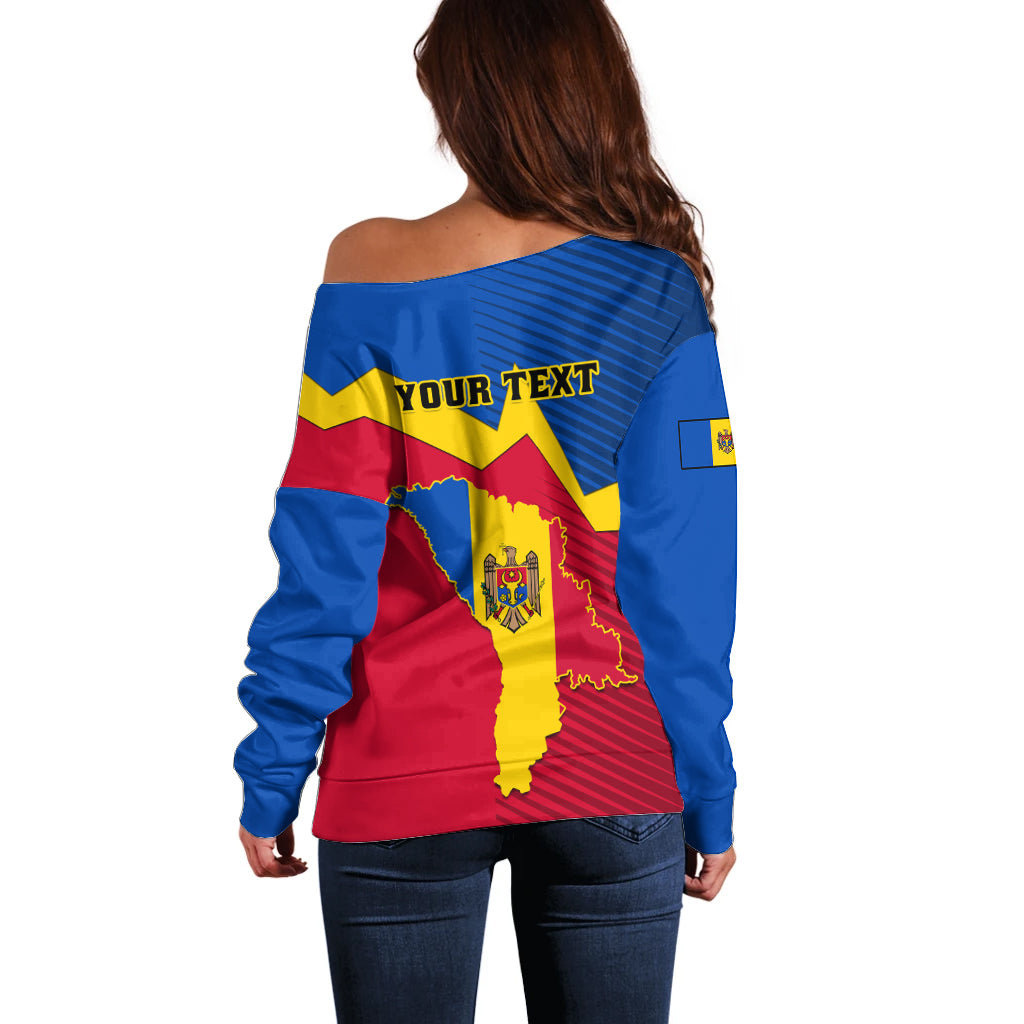 Back of off-shoulder sweater with blue-yellow-red map graphic and “YOUR TEXT” print