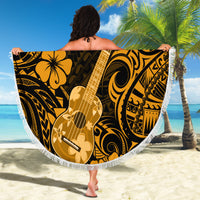 Round beach blanket with white fringe, gold ukulele graphic and floral Polynesian swirl pattern.