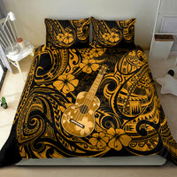 Gold and black ukulele bedding set with bold tribal swirls, flowers, and two pillow shams