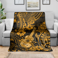 Folded Hawaiian ukulele blanket in gold and dark polynesian pattern with floral motifs