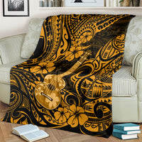 Hawaiian ukulele blanket draped on sofa, gold floral and swirl polynesian design
