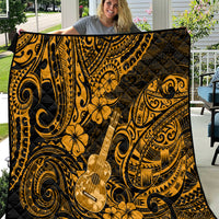 Gold and black ukulele print quilt with Polynesian scrolls and floral motifs, draped